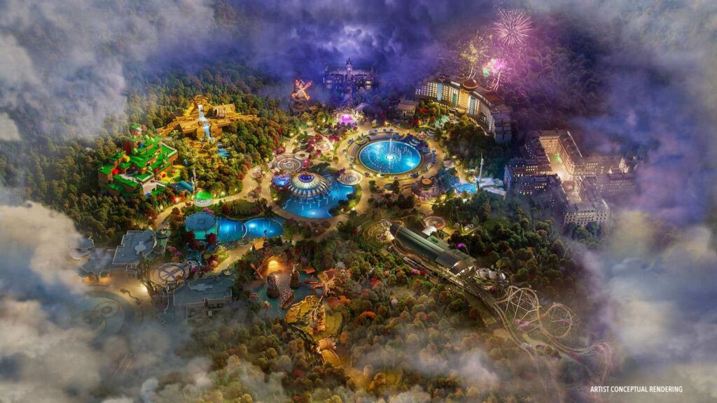 Imagem ilustrativa mostra como será o futuro parque epic universe que vem para orlando integrar o complexo de parques temáticos da universal. mostra uma imagem aérea do paruqe, com fogos iluminando a noite, fontes de água e as atrações das áreas principais